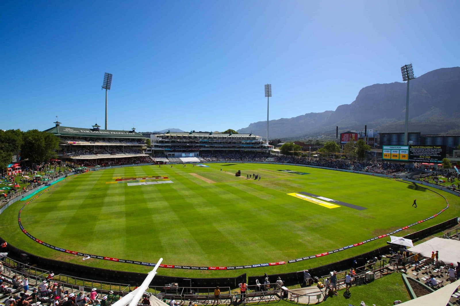 Newlands Cricket Ground in Cape Town, with the playing field and spectator stands beneath Table Mountain.
